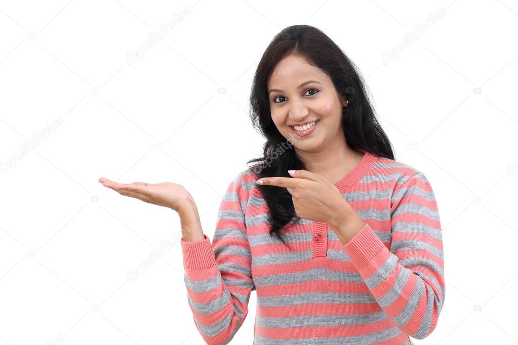 Young Indian woman showing blank copy space