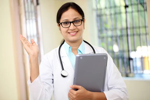 Young female doctor with tablet computer — Stock Photo, Image