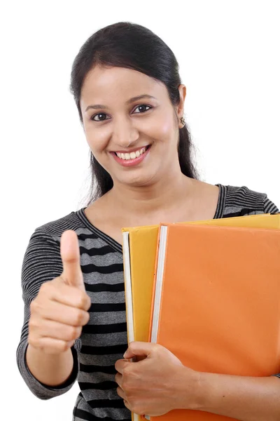 Cheerful female student with thumbs up gesture — Stock Photo, Image