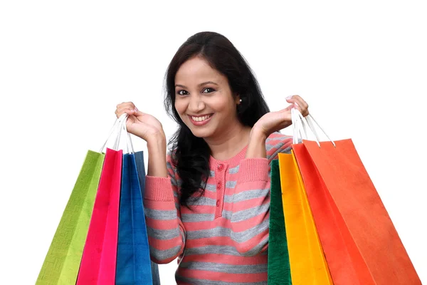 Joven feliz mujer sonriente con bolsas de compras —  Fotos de Stock