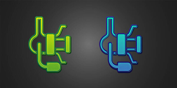Green and blue Spinning reel for fishing icon isolated on black background. Fishing coil. Fishing tackle. Vector