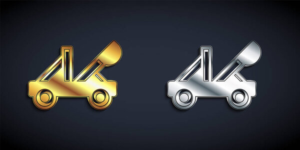 Gold and silver Old medieval wooden catapult shooting stones icon isolated on black background. Long shadow style. Vector