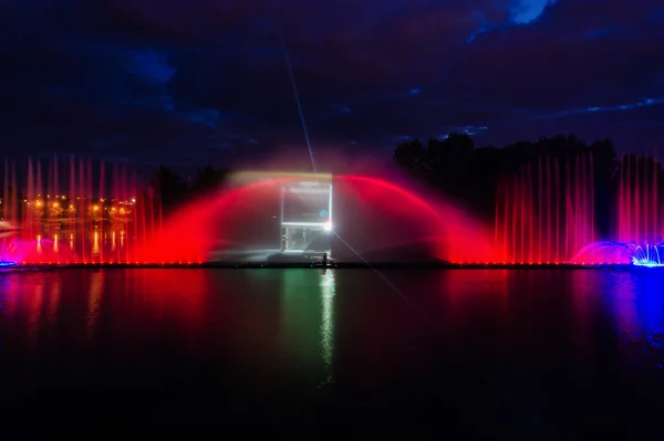 Night magic show of fountains on the central waterfront Roshen