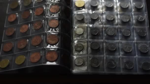 Collection of various vintage coins in the album. — Stock Video