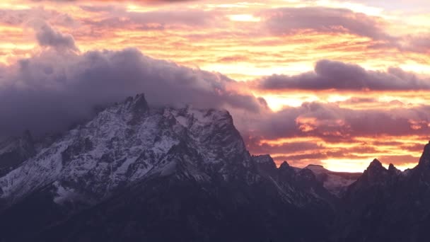 Panning Grand Teton Mountains Colorful Sunset Fiery Glow Snow Peaks — Stock Video