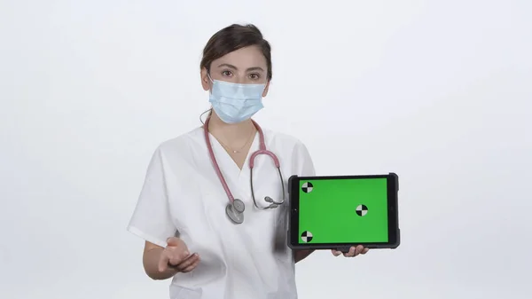 Female Doctor Turning Folding Arms While Smiling Moving Them White Stock Image