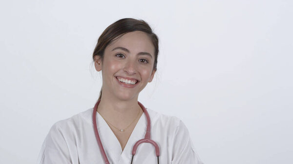 Female Doctor Turning Folding Arms While Smiling Moving Them White Stock Photo