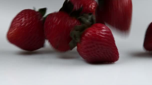 Strawberry dropping on surface — Stock Video