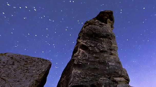 Astronomical time-lapse looking up rock pillars at Mount Arbel. Cropped. — Stock Video