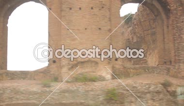 Tourists holding umbrellas while walking around St. Peter's Plaza