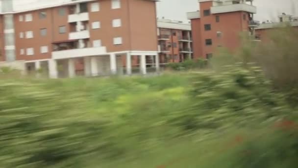 Italian houses and greenery from a train — Stockvideo