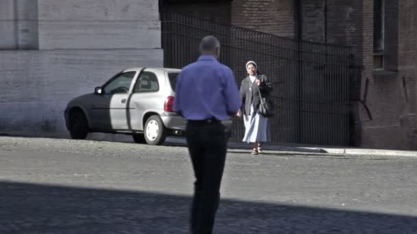 Two nuns crossing a street — Stock video