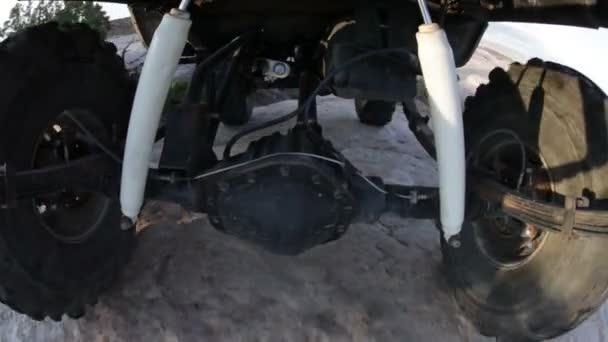 Undercarriage of a jeep while driving through Moab — Stock Video