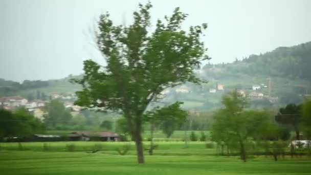 Italian countryside and farmland from train. — Stock Video