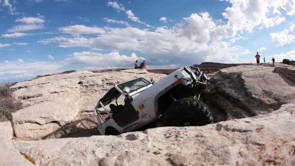 Jeep slowly climbing a steep rock — Stock Video