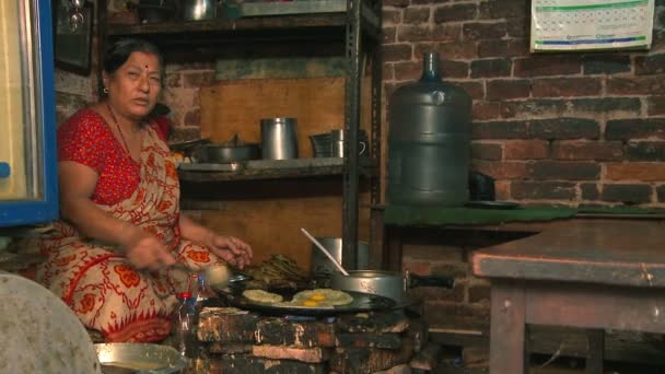 Woman cooking authentic Nepali food — Stock Video