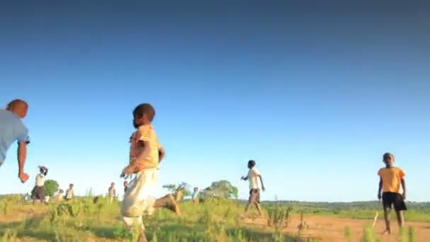 Boys playing football in the field — Stock Video
