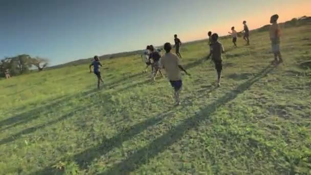 Children playing soccer on the fields in Kenya, Africa. — Stok video