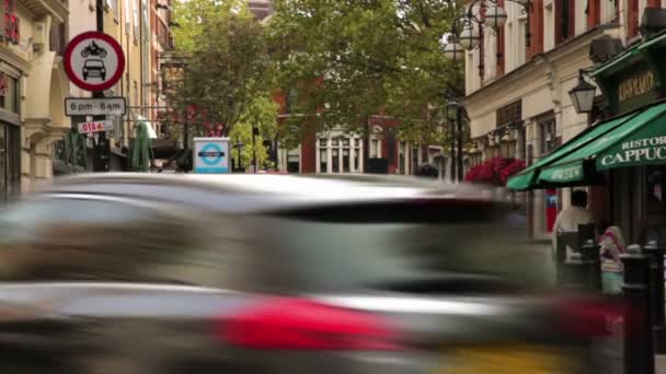 People walking on the sidewalks in Soho Square — Stock Video