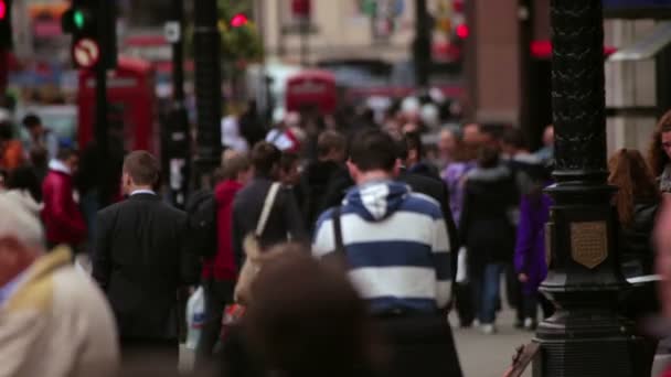 People walking on a busy street in London — Stock Video