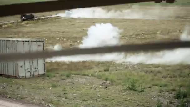 Shot from bridge-like structure of and explosion near road — Stock Video