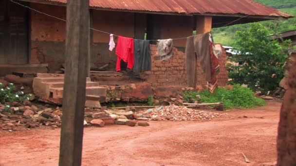 Town street in Africa with clothes hanging to dry — Stock Video