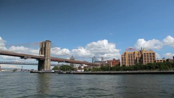 View of the New York City Skyline while floating the East River by ferry. — Stock Video