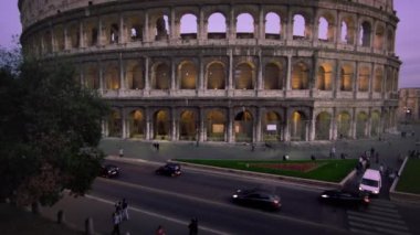 street and Colosseum during the evening.