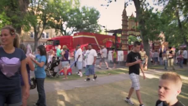 People walking around a carnival — Stock Video