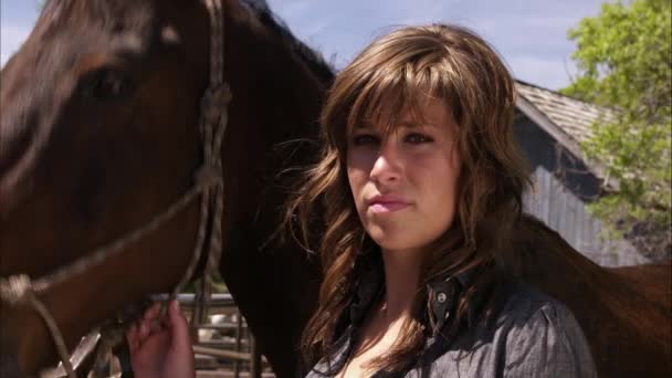 Slow motion shot of a woman with her horse. — Stock Video