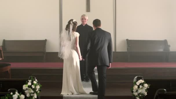 Couple kisses, turns, and walks down the aisle — Stock Video