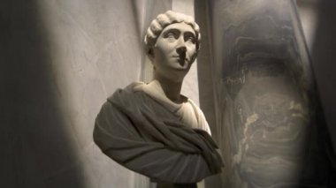 Zoom in towards female bust in the New Wing