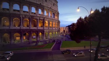 street and illuminated Colosseum at night