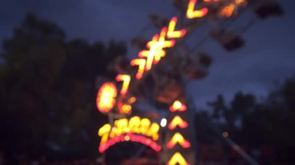 Rack focus shot of carnival ride — Stock Video