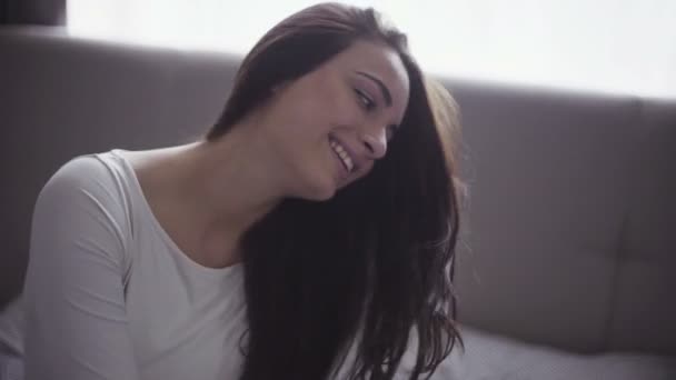 Attractive young female makes poses like a model, cheerful girl smiles on camera. — Stock video