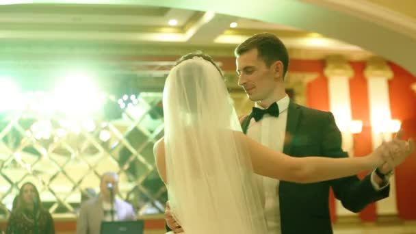 Wonderful young couple in love dancing their first valse in a restaurant. — Stock Video