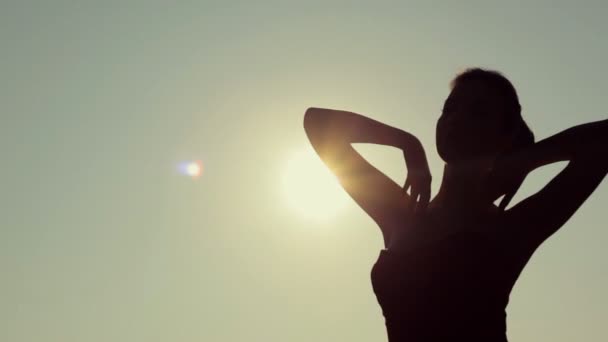 Close up of adorable young woman in red dress relaxing on the sun. — Stock Video