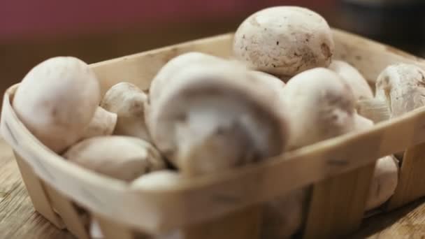 Cultivated mushrooms in a basket closeup — Stock Video