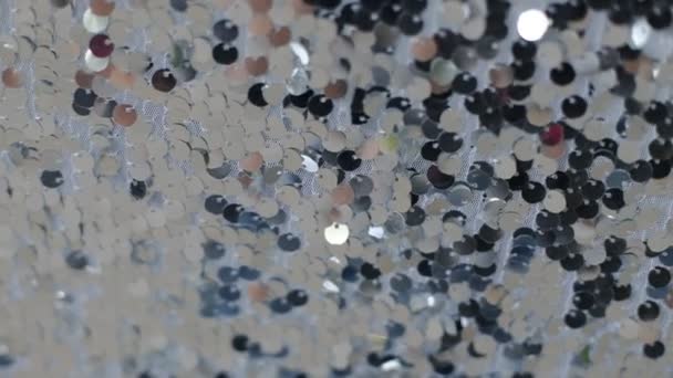 Texture de tissu en gros plan, recouvert de points réfléchissants qui donnent à l'image ses paillettes . — Video