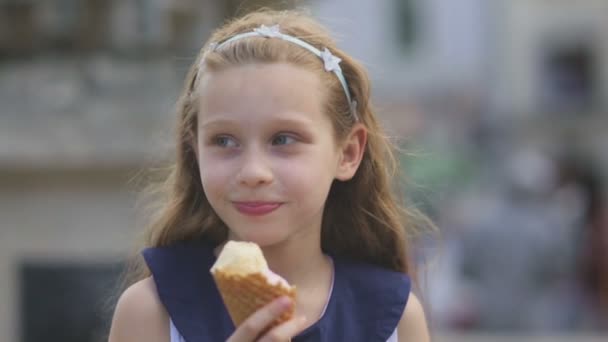 Little girl eating Ice Cream on a Hot, Torrid Summer Day at Playground in Park, Children — Stock Video