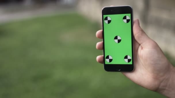 Holding Touchscreen Device, Close-up of female hands using a smart phone. chroma-key, green-screen — Stock Video