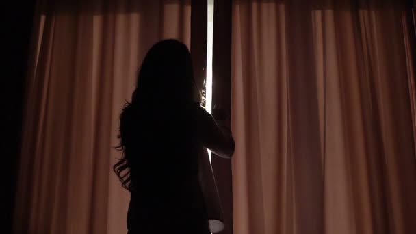 Charming woman unveil curtains in room in the morning — Stock Video