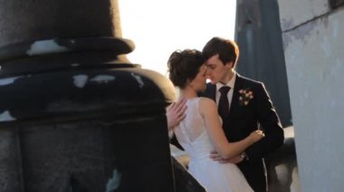 wonderful rich bride and groom holding hands on the terrace shot in slow motion  close up