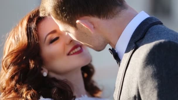 Young married couple kissing shot in slow motion  close up — Wideo stockowe