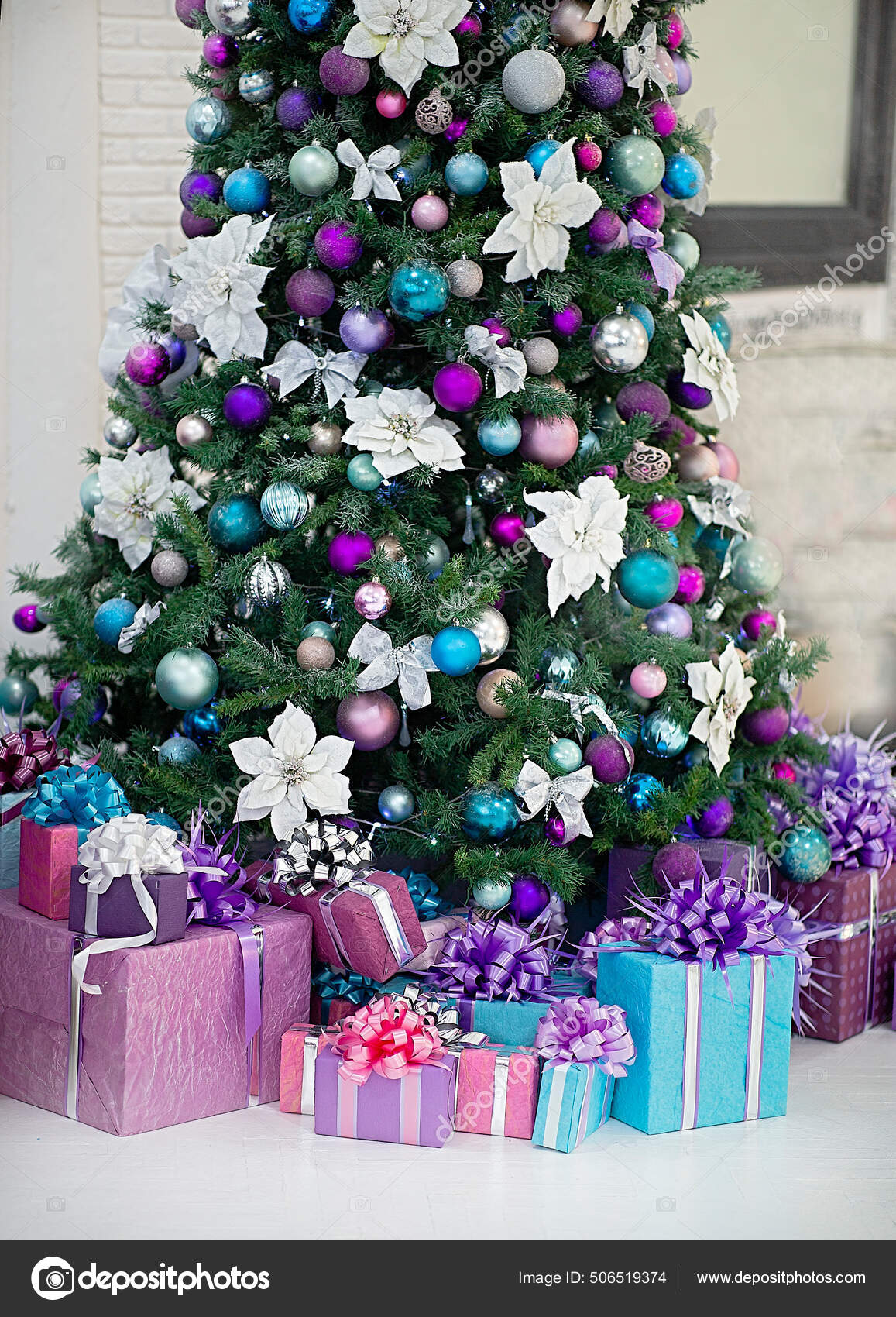 Beautiful decorated Christmas tree. Under it are gifts. The main ...