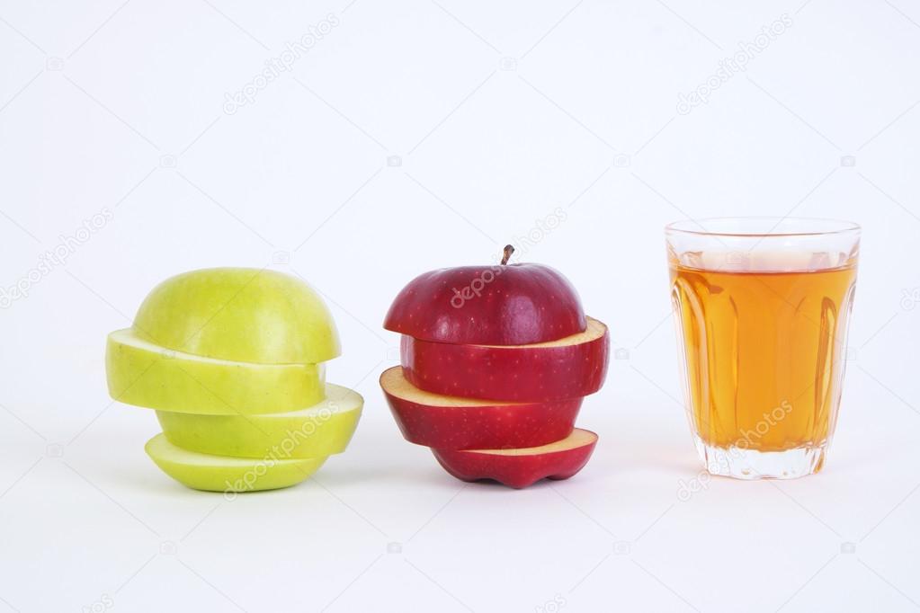 Apple sliced sections and apple juice. Red and green apple on white background