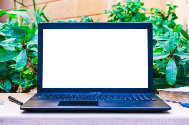 Laptop computer mock up with beautiful pencils on wood texture i