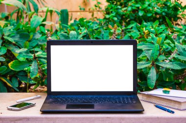 Laptop computer mock up with beautiful pencils on wood texture i