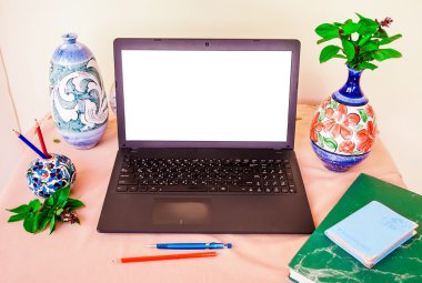 Laptop computer mock up with beautiful islamic style vases and p