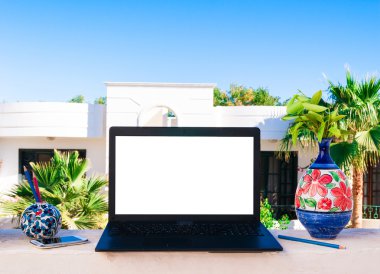 Laptop computer mock up with beautiful vases and pencils on wood